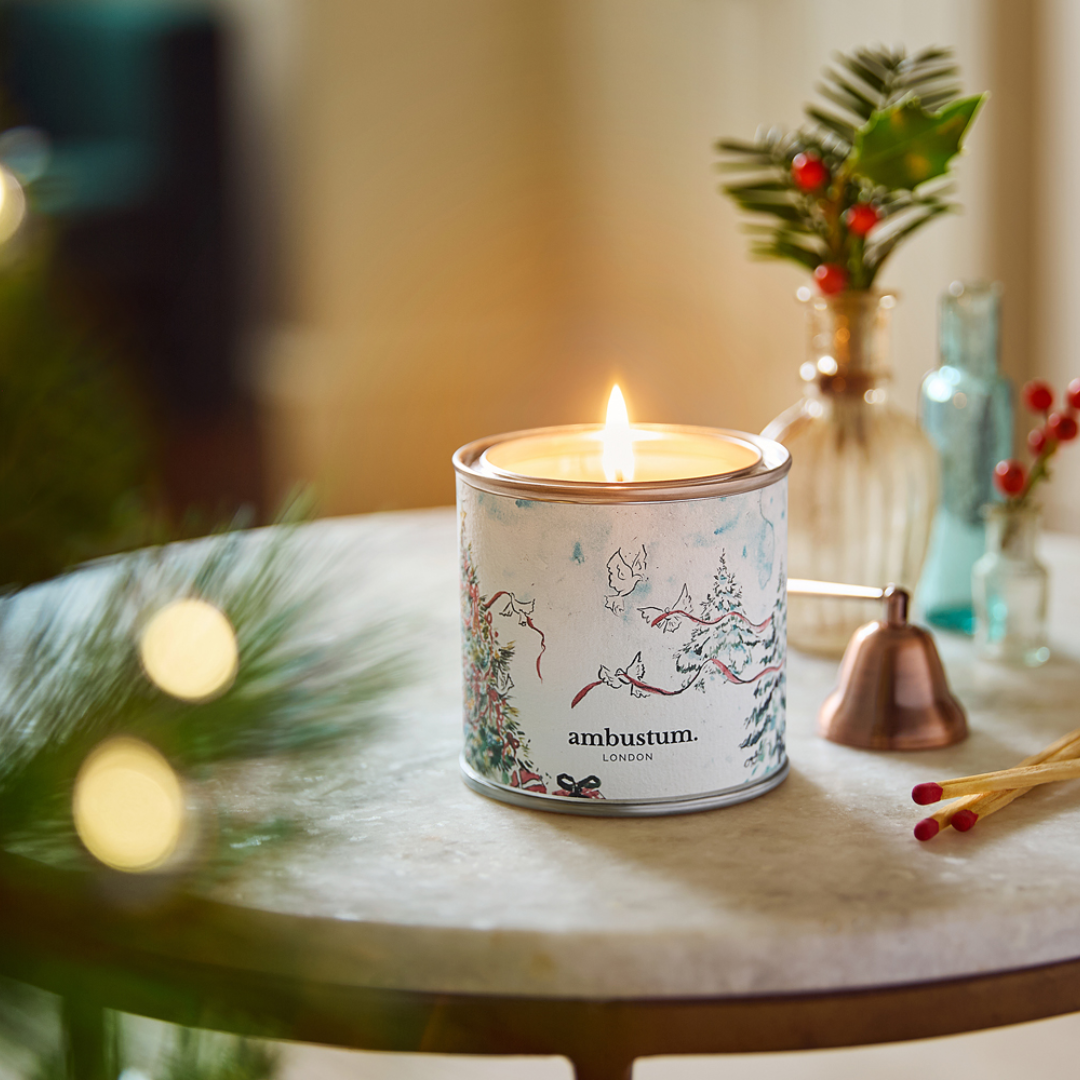 An ambustum Christmas Tree candle tin. A rich Herbal fragrance dominated by Siberian Pine alongside Eucalyptus & Precious Woods.